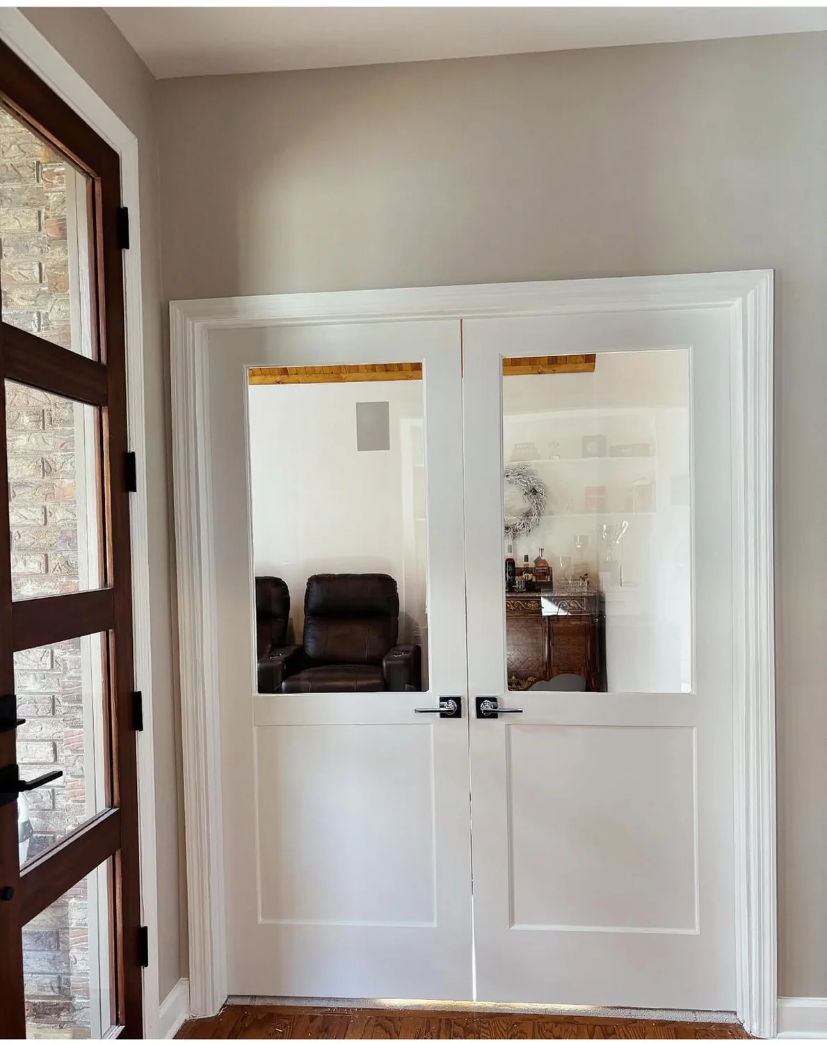 White interior double doors with large clear glass panels